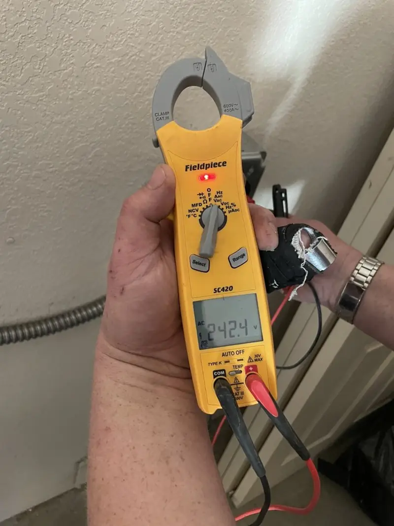 Voltage testing with clamp meter during Ceiling Fan Installation in Gainesville